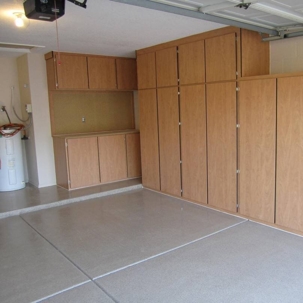 garage equipped with storage cabinets